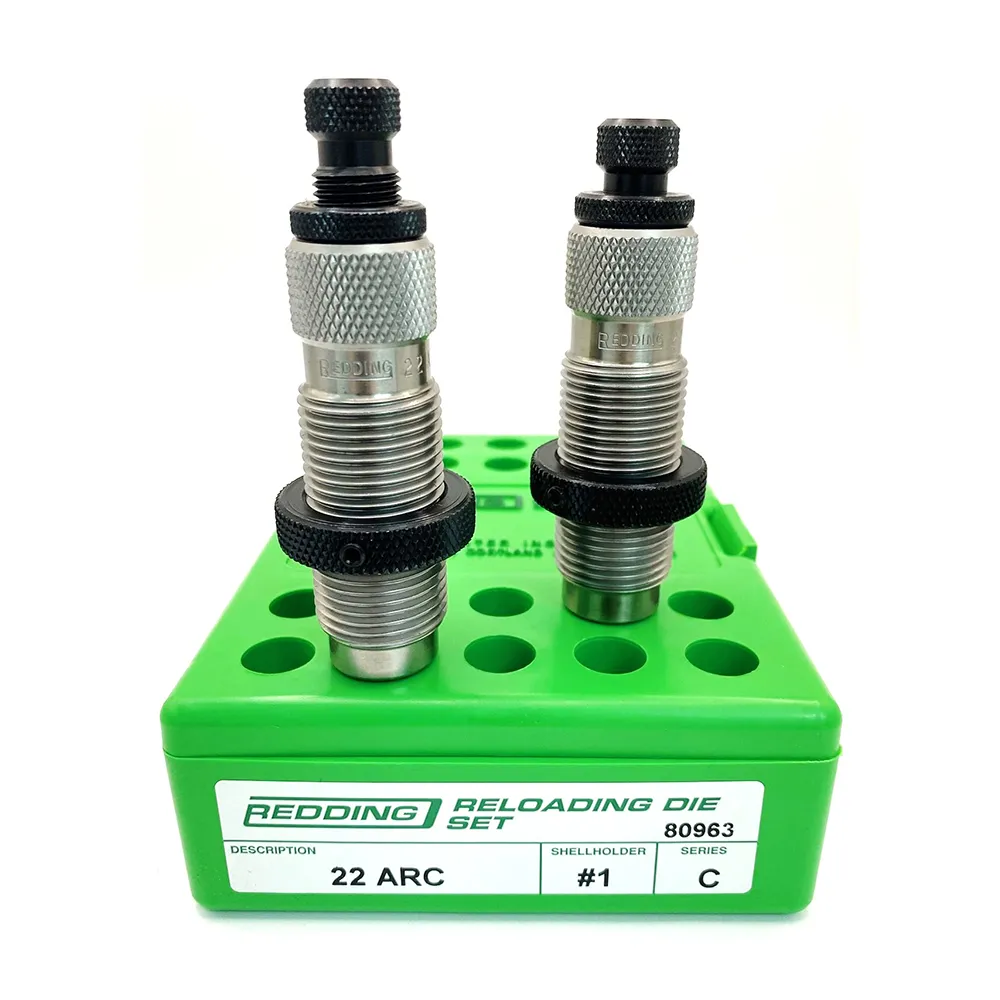 Redding 22 ARC precision reloading die set displayed on a green Redding case, featuring two metal dies used for accurate ammunition reloading
